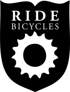 Ride Bicycles Sheild: bicycle t-shirt design with the words “RIDE BICYCLES”